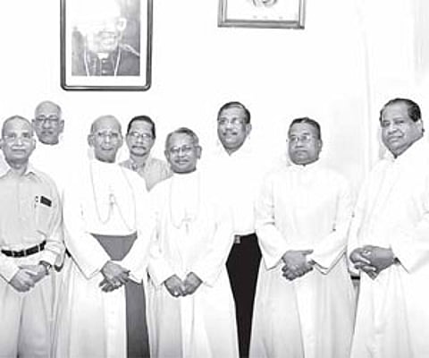 Verapoly Archbishop Daniel Acharuparambil and Auxiliary Bishop Joseph Karikkassery with priests and laymen who were conferred with papal honours.