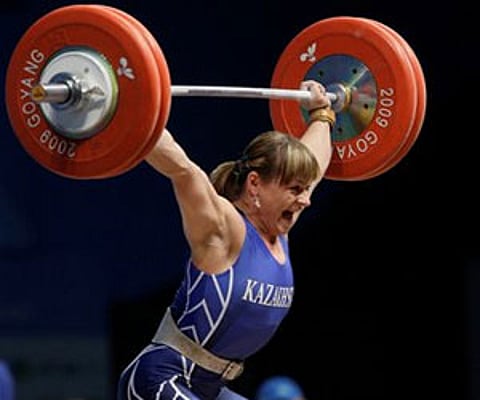 Svetlana Podobedova strains in the snatch of the women's group A 75-kilogram category of the World Weightlifting Championships in Goyang. (AP)
