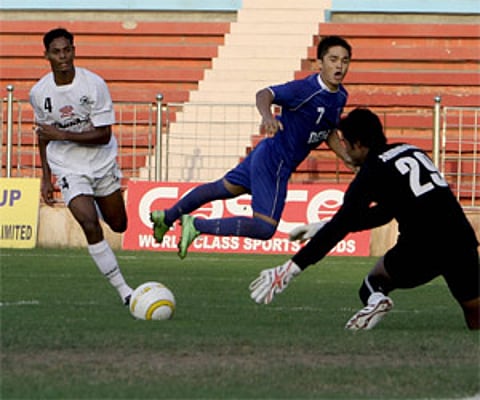 Sunil Chhetri of Dempo Blue and Rowilson Rodrigues of Churchill Brothers in action during the Durand Cup semifinals. PTI