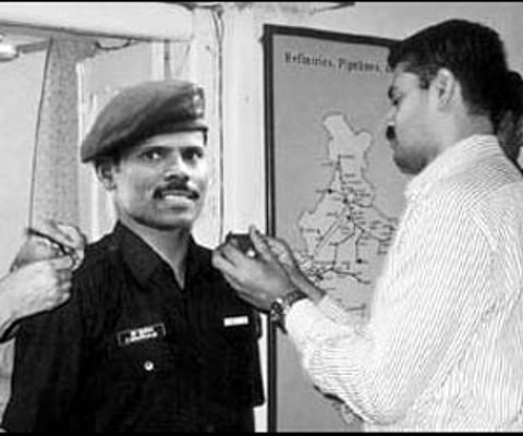 Captain R Murugaiyan being honoured with the Major rank