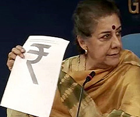 Information and Broadcasting Minister Ambika Soni shows the new Rupee symbol. (Screen grab: Courtesy NDTV)