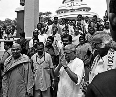 Chief Minister V S Achuthanandan descending the steps after visiting the resting place of Sree Narayana Guru at Sivagiri on Thursday