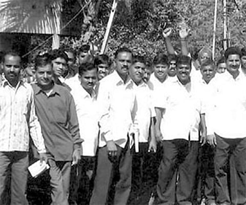 Nagesh Desai with his supporters campaigning for his wife Shubhangi, at Sambra recently | Express Photo