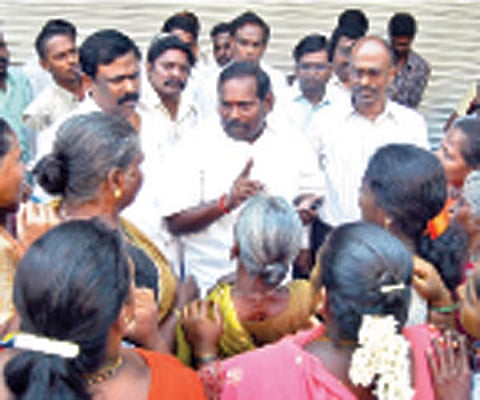 how the other half live: Officials interact with pavement dwellers on Mission street on Wednesday in the UT
