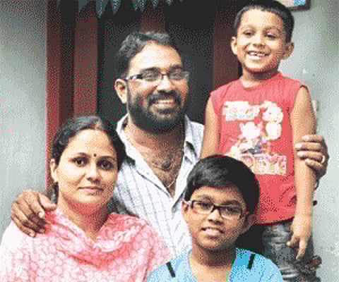 Radhakrishnan Mangalath with his wife Lathika and sons Krishnanunni and Unnikrishnan.