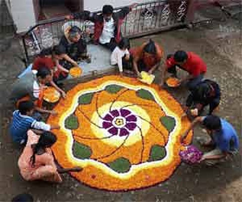 Elaborate 'pookalams' (floral designs) adorned Kerala homeson Onam. PTI Photo