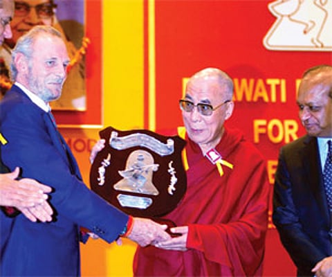 Mr. Mark Shand, presenting the Dayawati Modi Award 2011 to His Holiness Dalai Lama.