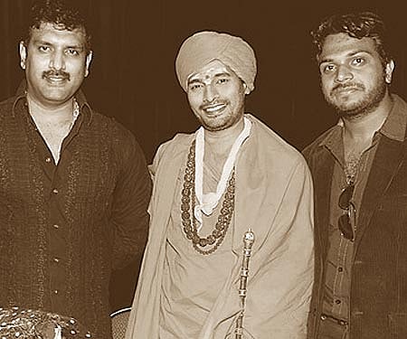 Actor Dharma, Sri Yogeshwara Rushikumar and Vasanth at the audio launch of film 'Akhaada'.