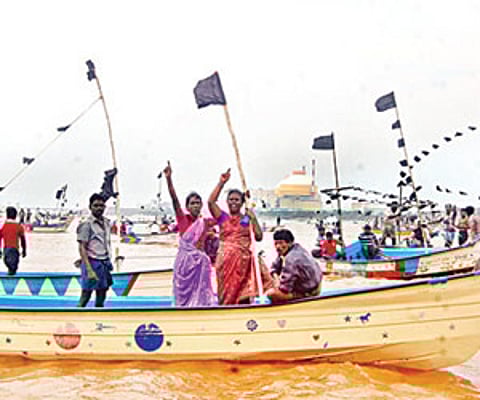 UP IN ARMS: Fishermen from the coastal belt protesting off the Koodankulam nuclear power plant with black flags on their boats on Monday | EPS