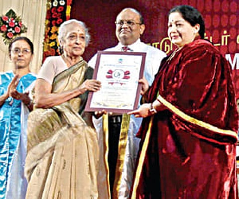 Chief Minister J Jayalalithaa presenting a lifetime achievement award to Cancer Institute founder Dr V Shantha during a convocation in Chennai.