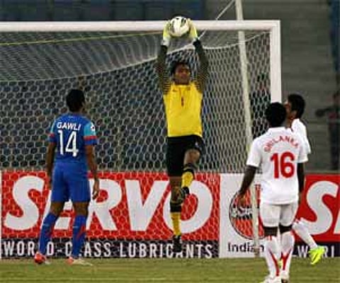 Indian goalkeeper Karanjit Singh jumps to save a goal against Sri Lanka at the SAFF Championship 2011 in New Delhi. PTI
