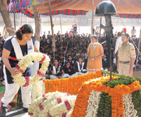 A student lays a wreath of flowers at the War Memorial at the Kendriya Vidyalaya Picket on Thursday | EPS