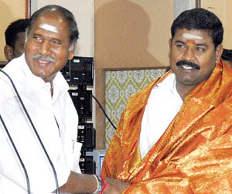 Chief Minister N Rangasamy greeting TPR Selvam, who assumed charge as Deputy Speaker on Wednesday.