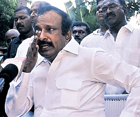Expelled AIADMK minister S Muthusamy reacts during a press meet in the city on Saturday.