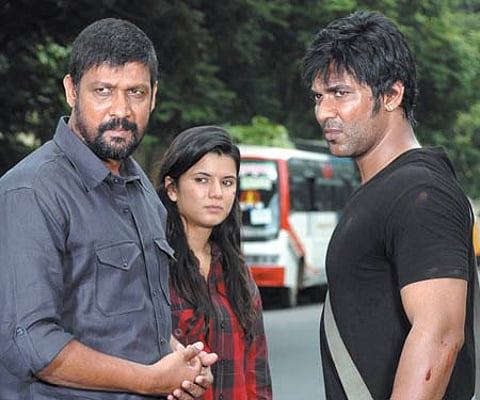 A still from 'Aanmai Thavarael'. EPS