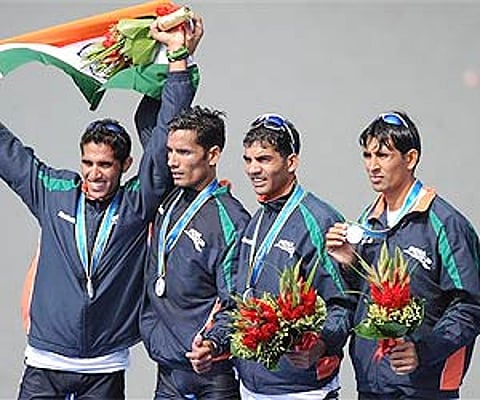 India's lightweight four rowing team celebrate their silver medal at the 16th Asian Games in Guangzhou, China