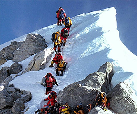 Everest begins to give up its dead