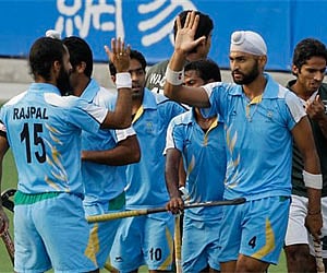 India's Singh Sandeep is congratulated by teammate Singh Raj Pal after scoring against Pakistan in hockey at the 16th Asian Games on Saturday. AP