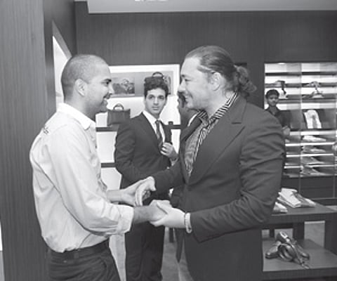 Harsha Reddy and Kelly Dorji greet each other at the fashion event.