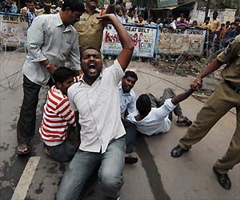 Police arresting activists of OUJAC who tried to force their way into the Minister’s Quarters at Banjara Hills protesting the AP Formation Day fete.