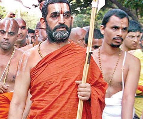 trek to lord: Chinna Jeeyar swamy on his way to the Lord Venkateswara temple in Tirumala on Friday. | Express Photo