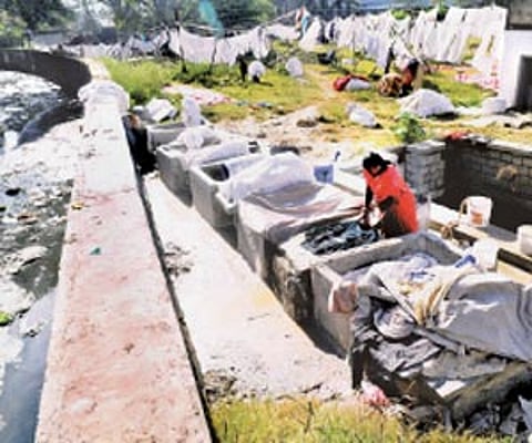 The open drain passing through dhobi ghat. (Below) Pollutted water in a open well | Nagesh Polali