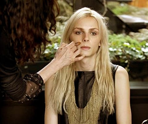 Photographer transgender model Andrej Pejic has make-up applied by Cecelia Romero for a fashion shoot in New York (AP Photo/Richard Drew).
