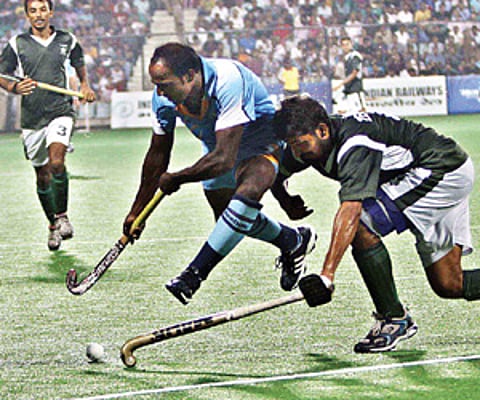 CHAK DE: A Pakistani hockey player vies for the ball against India at the CWG on Sunday. India won 7-4.