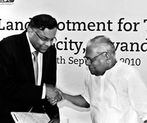 Chief Minister V S Achuthanandan handing over the government order TCS chief executive officer N Chandrasekaran. (ENS)