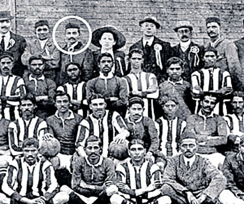Gandhiji lines up in the back row of a Passive Resisters Soccer Club team photo