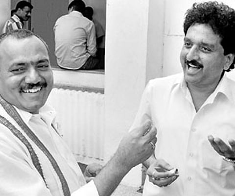 Newly-appointed chief whip Gandra Venkataramana Reddy (left) sharing a light moment with whip R Padmaraju on the Assembly premises in Hyderabad on Thu