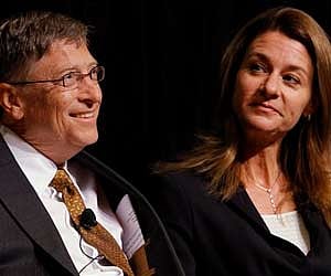Bill Gates smiles with his wife Melinda Gates, during a ceremony honoring the couple with the 2010 J. William Fulbright Prize in Washington on Friday.