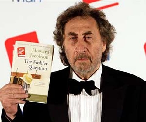 Howard Jacobson, displays his book 'The Finkler Question', following the announcement of the Man Booker Prize, at central London's Guildhall. (AP)