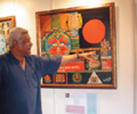 Sangeetha trying to make her ailing mother Baby stand up from the chair. ENS