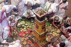 Widows offer prayers at the ‘Tulsi’ pedestal in a Puri temple as part of Kartik month rituals.