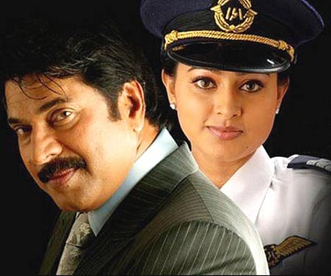 The poster of 'Vande Mataram' featuring Mammootty and Sneha.