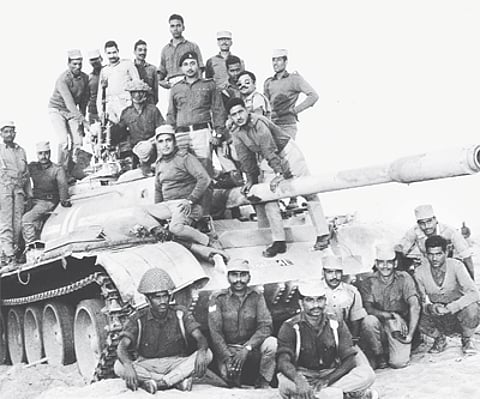 Indian soldiers with a captured Pakistani tank in the western sector