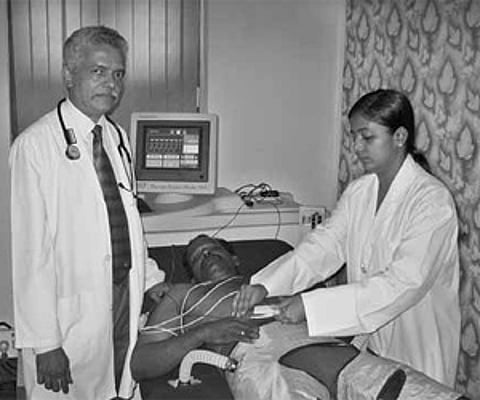 Dr Gopalakrishnan A Pillai administering EECP® Therapy to a patient at Hridaya Care Heart Institute in Aluva | express