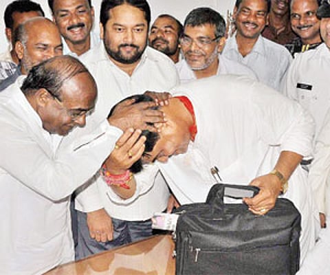 Former minister Damodar Rout greets Ranendra Pratap Swain after the oath was administered by Speaker Pradip Amat (extreme right) in the Assembly | EPS