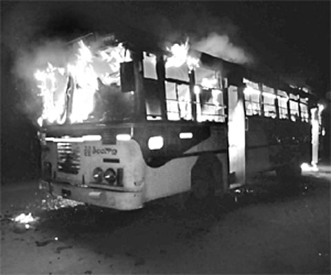 An RTC bus in flames after two youths set it ablaze near German guest house on the outskirts of Vemulawada on Sunday evening. | Express Photo