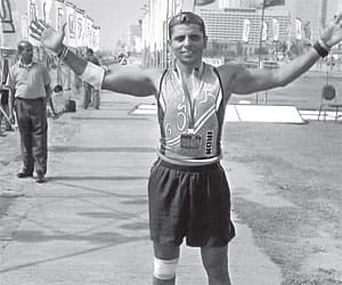 Sunil Menon celebrates after finishing the Half Iron Man event in Colombo, Sri Lanka.