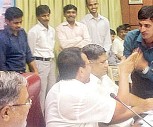 Engineer Srinivas being greeted by the Chief Minister