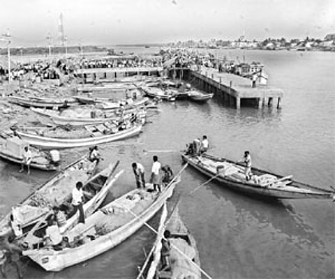 Fishermen venture out in the waters at Bairavapalem in Yanam on Sunday, as calm returned to the picturesque town after two days.