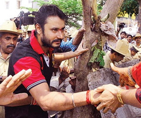 Actor Darshan meeting his fans outside his residence in Bangalore on Saturday | Express Photo