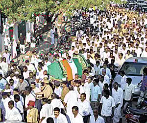 Legend passes: Leaders and public participating in the funeral procession, in Puducherry on Friday.