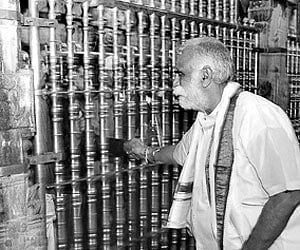 TTD chairman K Bapiraju monitoring a queue at Tirumala on Sunday.