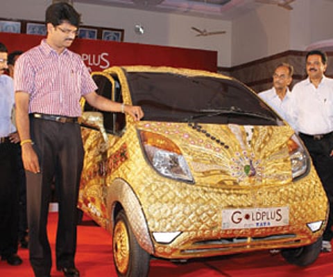 VIT vice president G V Selvam who inaugurated the exhibition of the Gold Plus Nano car in Vellore on Tuesday, having a closer look at the vehicle