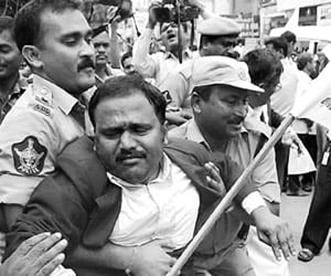 Police taking a lawyer into custody in Warangal on Tuesday.