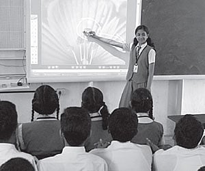 A student using the digital ‘Smart Board’ at Viswajyothi CMI Public School in Angamaly