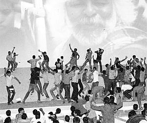 Youths dancing at the screen during screening of ‘Jai Bolo Telangana’ at Devi theatre in Hyderabad on Friday.
